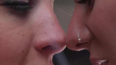 2 smokey ladies sharing some virginia slims close up