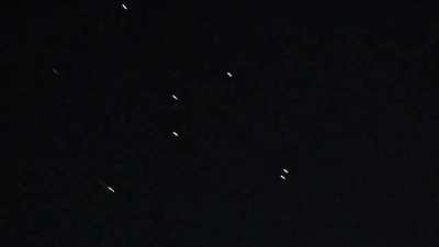 Footage showing a large amount of Iron Dome interceptions over the West Bank with debris falling (April 14, 2024)
