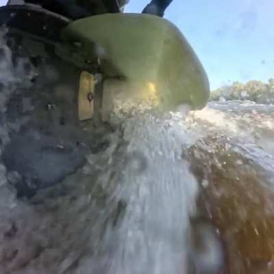 Surfacing outboard, fun perspective shot