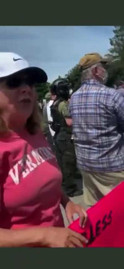 Racist karen goes off on protesters.