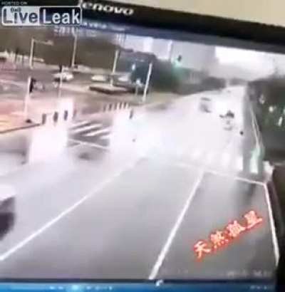 Tricyclist flips when struck by a truck.