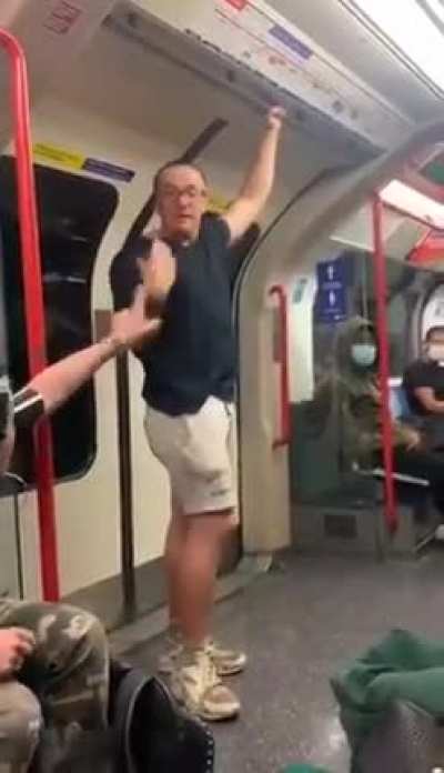 A tough guy gets knocked out after being racist towards three black men in London Underground