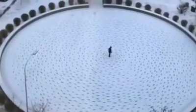 Bored man walks in circles on the snow