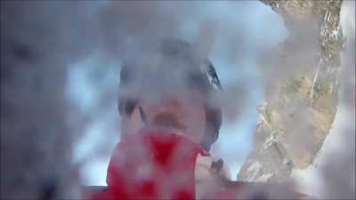 Snowboarder Falls Off Rocky Cliff
