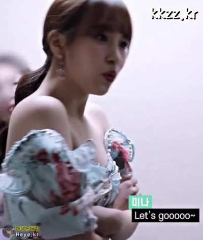 Mina - ponytail, flower dress, close up