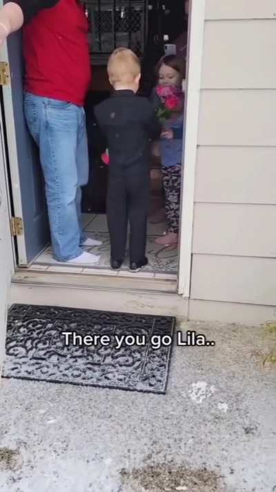 Courteous Child Giving Valentines Flowers.
