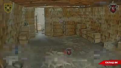 A Ukrainian FPV pilot of the 28th Mechanized Brigade attacks a Russian ammunition depot hidden inside a warehouse with a fibre-optic quad.