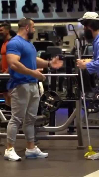 Cheerful "janitor" in the gym