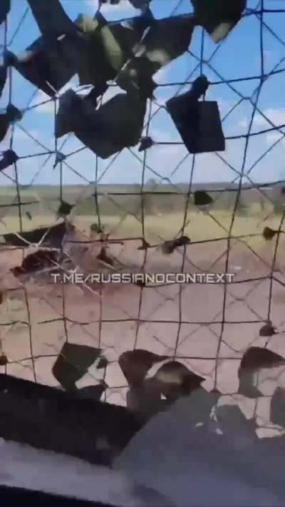 UA POV: A Russian serviceman filmed the moment a Ukrainian FPV drone attacked his Bukhanka "Loaf" van that was equipped with an electronic warfare system and netting that FAILED to stop it