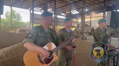 Ru pov: Video footage of a small military concert by VIA "Sineva" was held in the special military operation zone to support and boost morale of Russian soldiers 