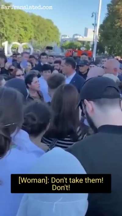 Woman standing up to official in Kabardino-Balkarian Republic, Russia. The official accuses her of having PR goals, while she is demanding to bring the mobilised children back.
