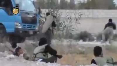 Chaotic scenes as a large gathering of Liwa al-Islam fighters engage Syrian Army positions with the assistance of a ZU-23-2 technical - Damascus - August 2012