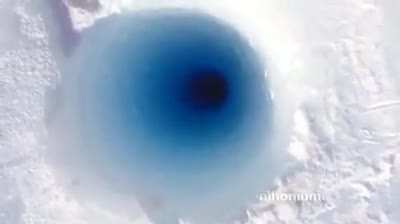 Dropping Ice Down A Hole In Antarctica.