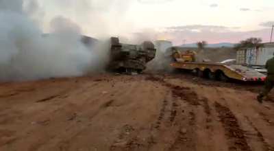 IDF Merkava mk3 flips while being loaded on a transporter