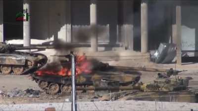 SAA T-72M1 taking a hit from a RPG-29, causing a cook off of the ammunition.