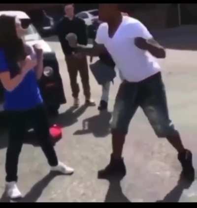 guy warns girl he’ll knock her out. she laughs at him. guy knocks her out