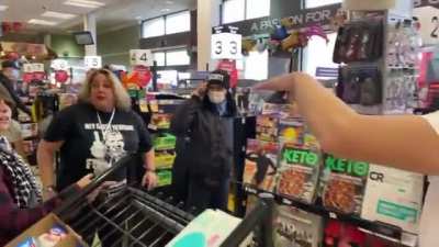 Anti mask mob invades a grocery store.