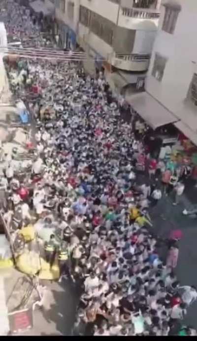 Scenes from Haizhu, Guangzhou. People lining up for a Covid test.