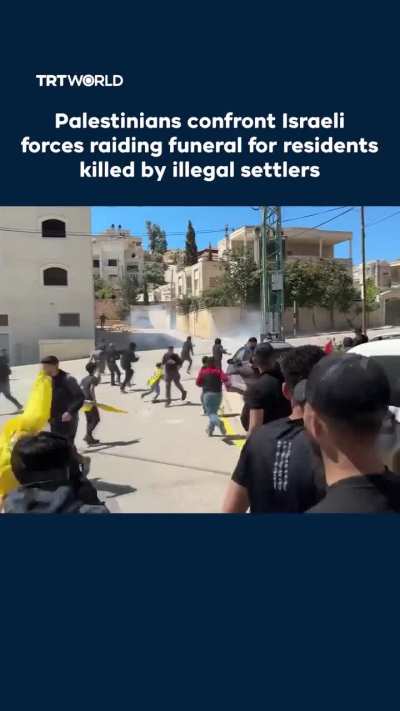 Palestinians confronted Israeli occupation forces that raided the funeral of two residents killed by Zionist settlers in Al Mughayyir village in the occupied West Bank on April 22.