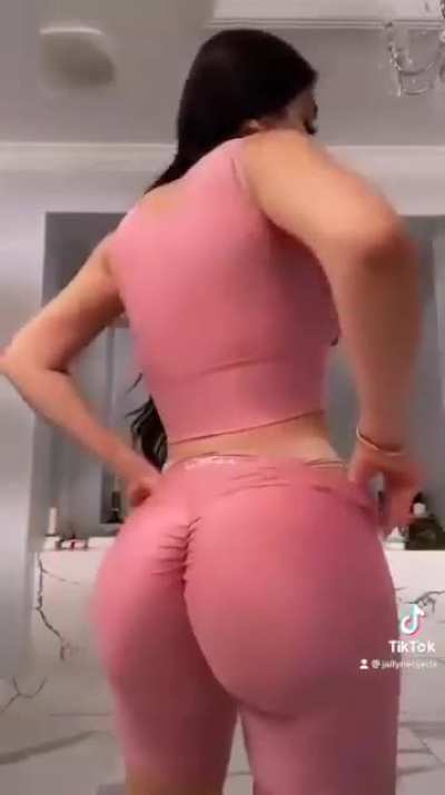 Squeezing her peach into some spandex.