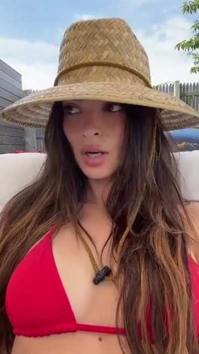 Wearing a straw hat