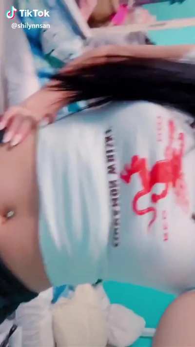 She really wants to show off her "shirt"