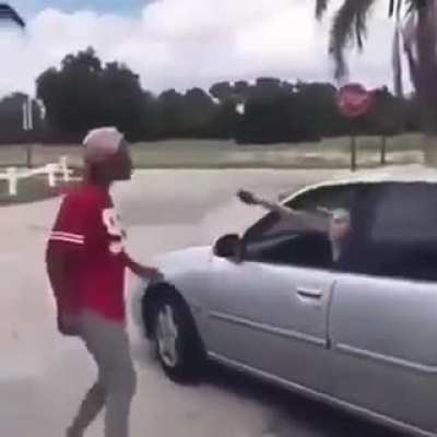 Woman pulls out a taser, would have been better for her to just drive away.