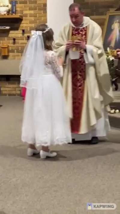 This priest soon realizes that it&rsquo;s the girl&rsquo;s first Communion.