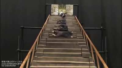 Creative performance of "samurai falls down the stairs"