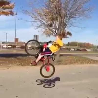 Kid making a jump with his bike