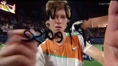 Russian tennis player Andrey Rublev writes "No War Please" on the camera after his win in Dubai today