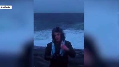 Fish hits weather man in the face. 
