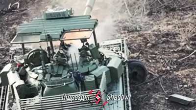 Ukrainian drone operator of the "shadow" unit drops a US M67 grenade into the open hatch of a Russian T-80 BVM MBT.