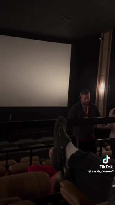 Dude disrupts movie because he is not in his assigned seat 