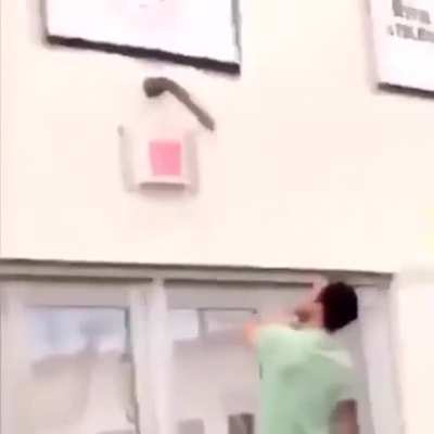 Desperately trying to get this massive dildo off this school gym&rsquo;s wall