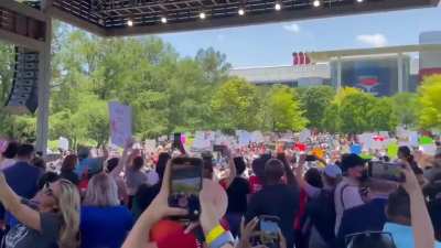 Protesters gather in front of NRA conference
