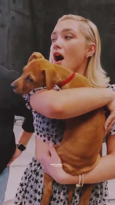 Florence Pugh and some puppies  