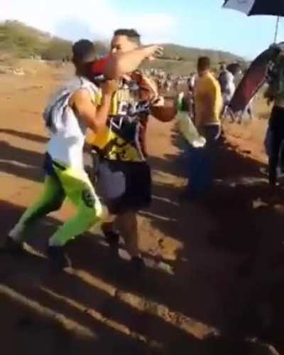 Let's stand in the middle of a road during a race!