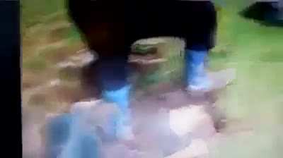 Just two people pulling something out of the sewer