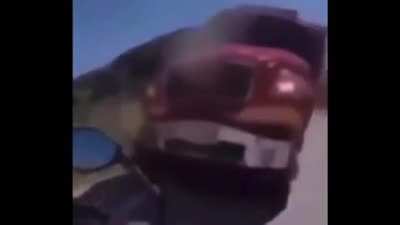 man gets run over by truck while ridng motorcycle (GRAPHIC)