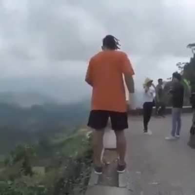 to back flipping on the edge off the cliff