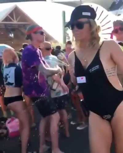 Spraying strangers with breast milk at a festival