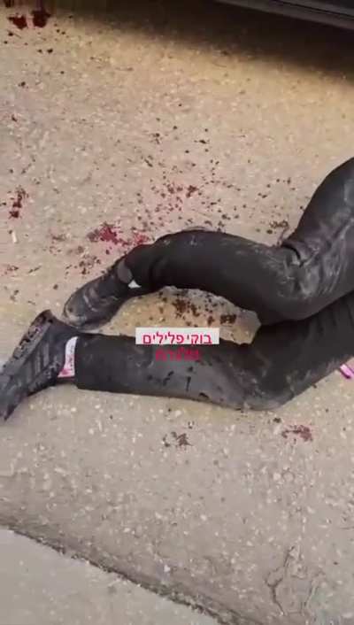 Palastine man throws rock on Israeli soldiers in response he is getting shot in the leg by mounted heavy weapon