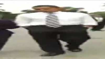Wide Barack Obama walking but he's always dancing