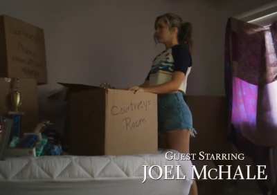 Brec wearing a crop top and jeans shorts in the Stargirl pilot