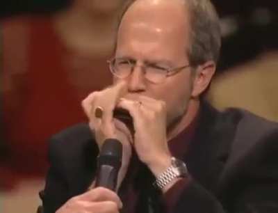 Magical musician takes Harmonica to a level 99.. 😀