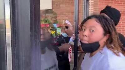 Protesters in Rochester NY try to enter a grocery store but are repelled by quick thinking employees and a glass door