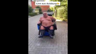 Aggressive German man in an electric wheelchair