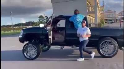 Walking next to a truck to film a video