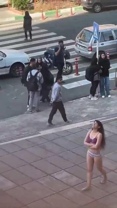 In Iran, a woman who was accosted by the &ldquo;morality police&rdquo; for not wearing hijab removes her clothing &amp;amp; roams the streets in defiance. She has since been arrested by IRGC forces and forcibly disappeared.
